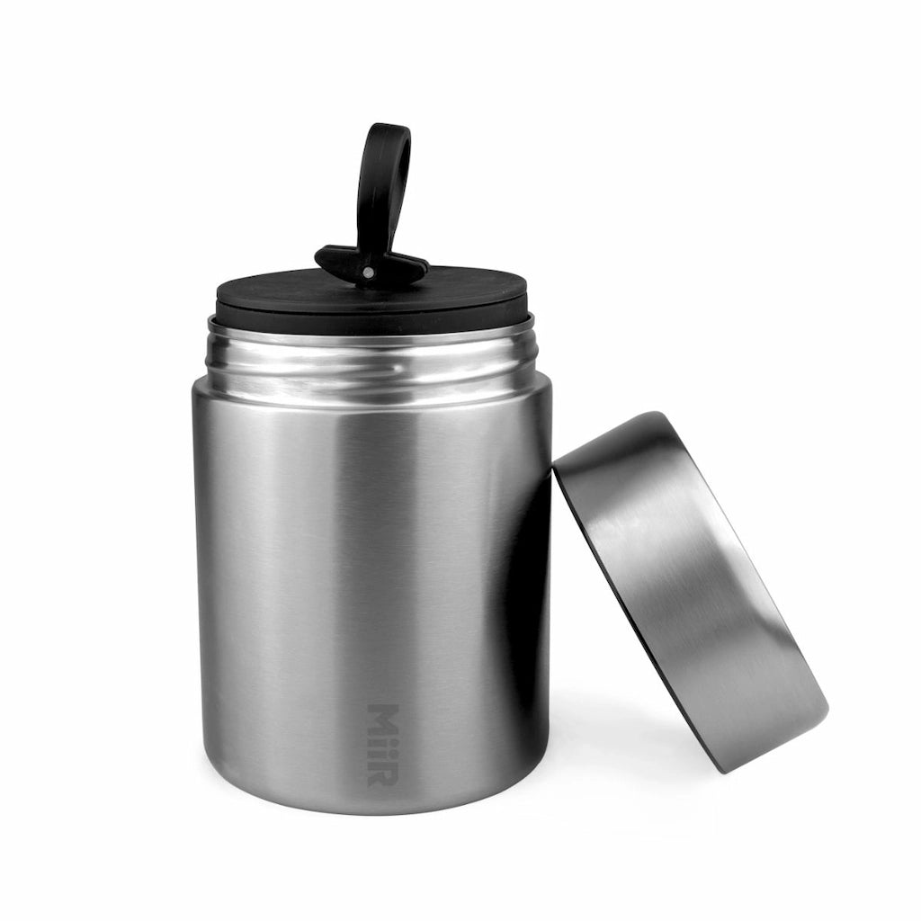 Stainless steel miir food jar with black lid on a white background