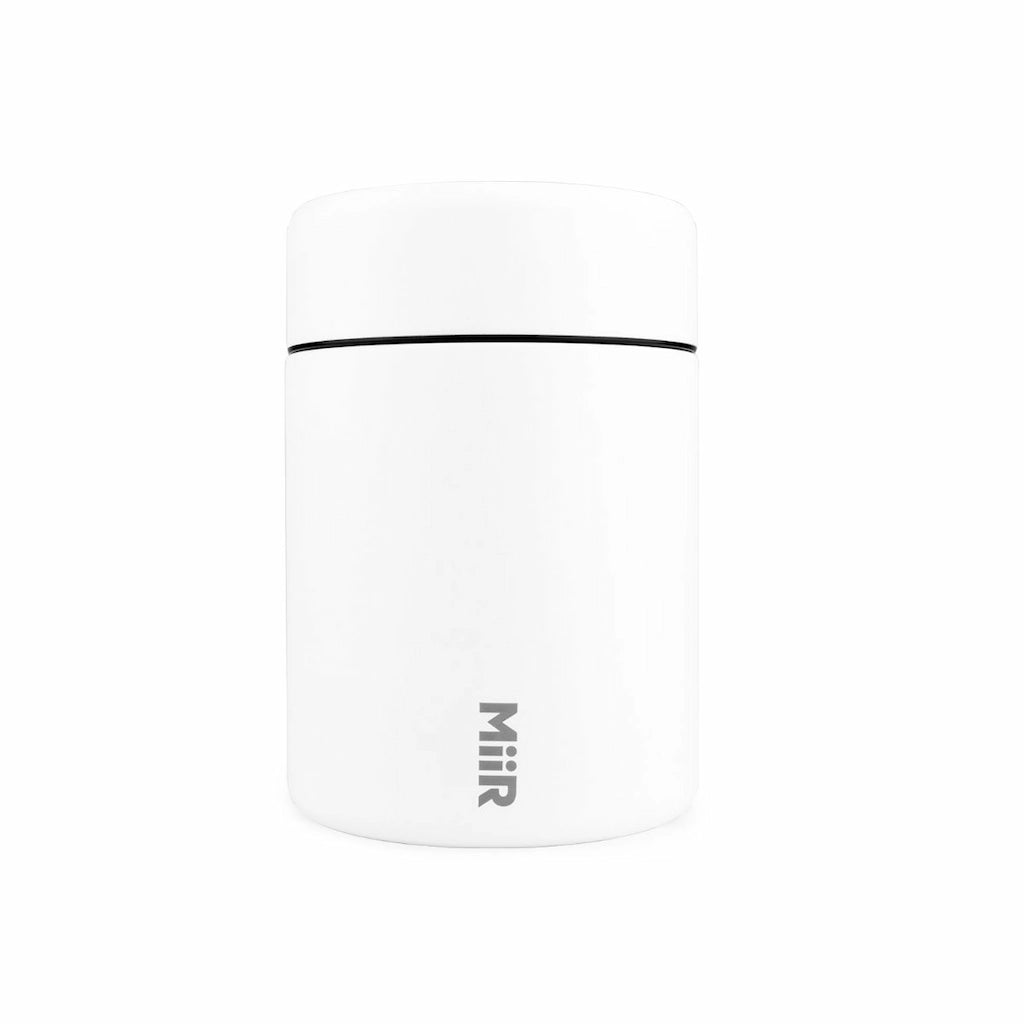 White mug with black rim and 'MIIR' logo on a white background
