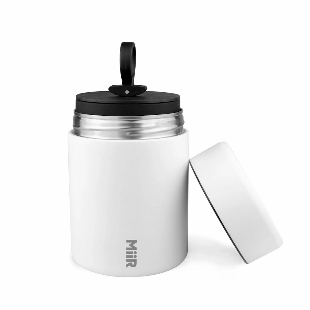 White insulated food jar with black lid on a white background, featuring the MiiR brand.
